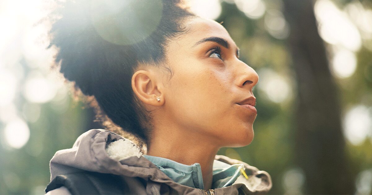 Woman thinking about telling her parents she's pregnant